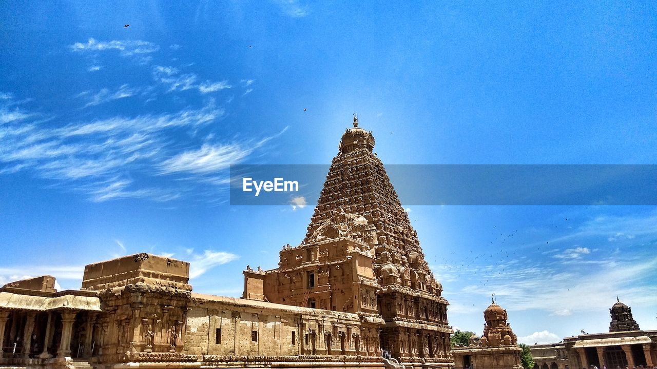 Low angle view of temple against blue sky