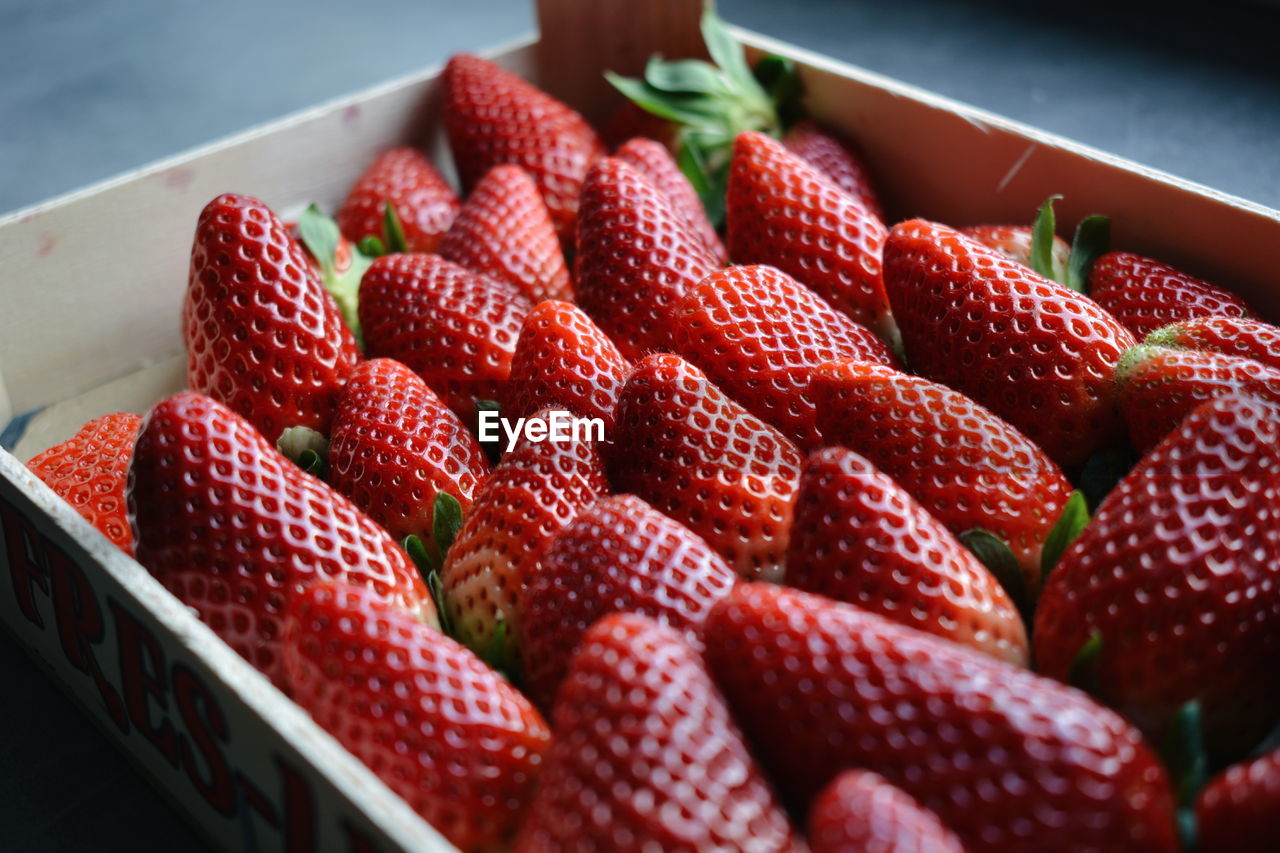 View of fresh strawberries in container