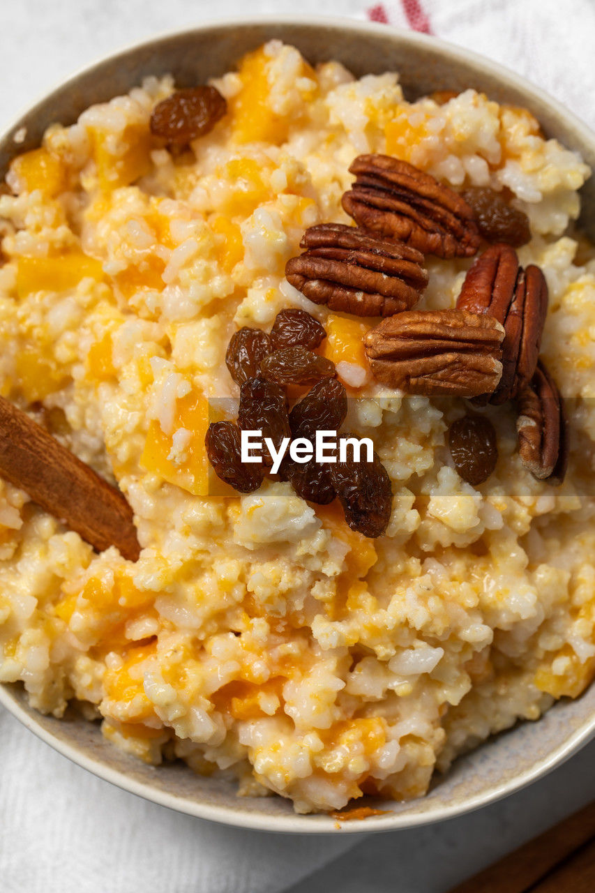 food and drink, food, breakfast, healthy eating, dish, meal, wellbeing, scrambled eggs, cuisine, produce, studio shot, indoors, fruit, rice - food staple, no people, vegetable, dried fruit, freshness, raisin, close-up, bowl, high angle view