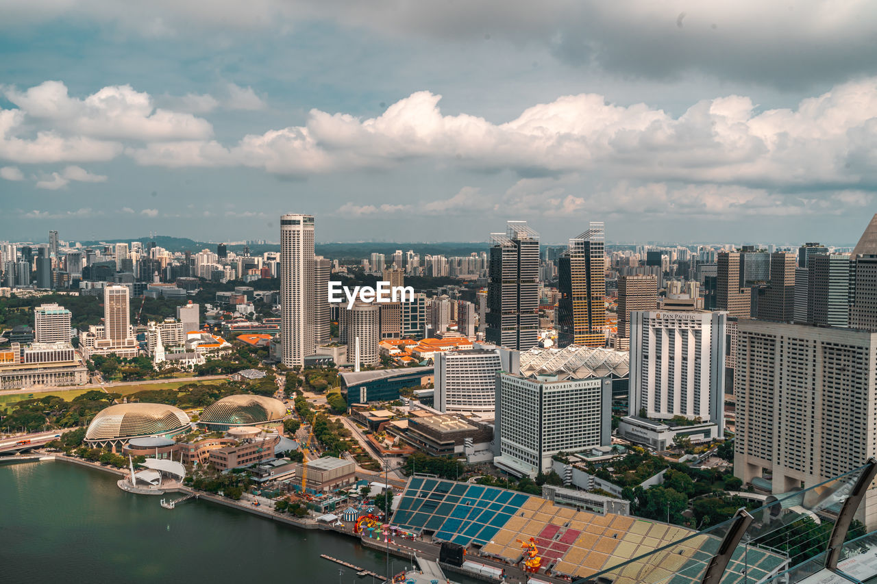 High angle view of modern buildings in city against sky