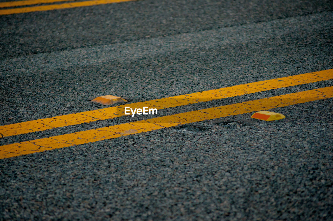 High angle view of double yellow lines on road