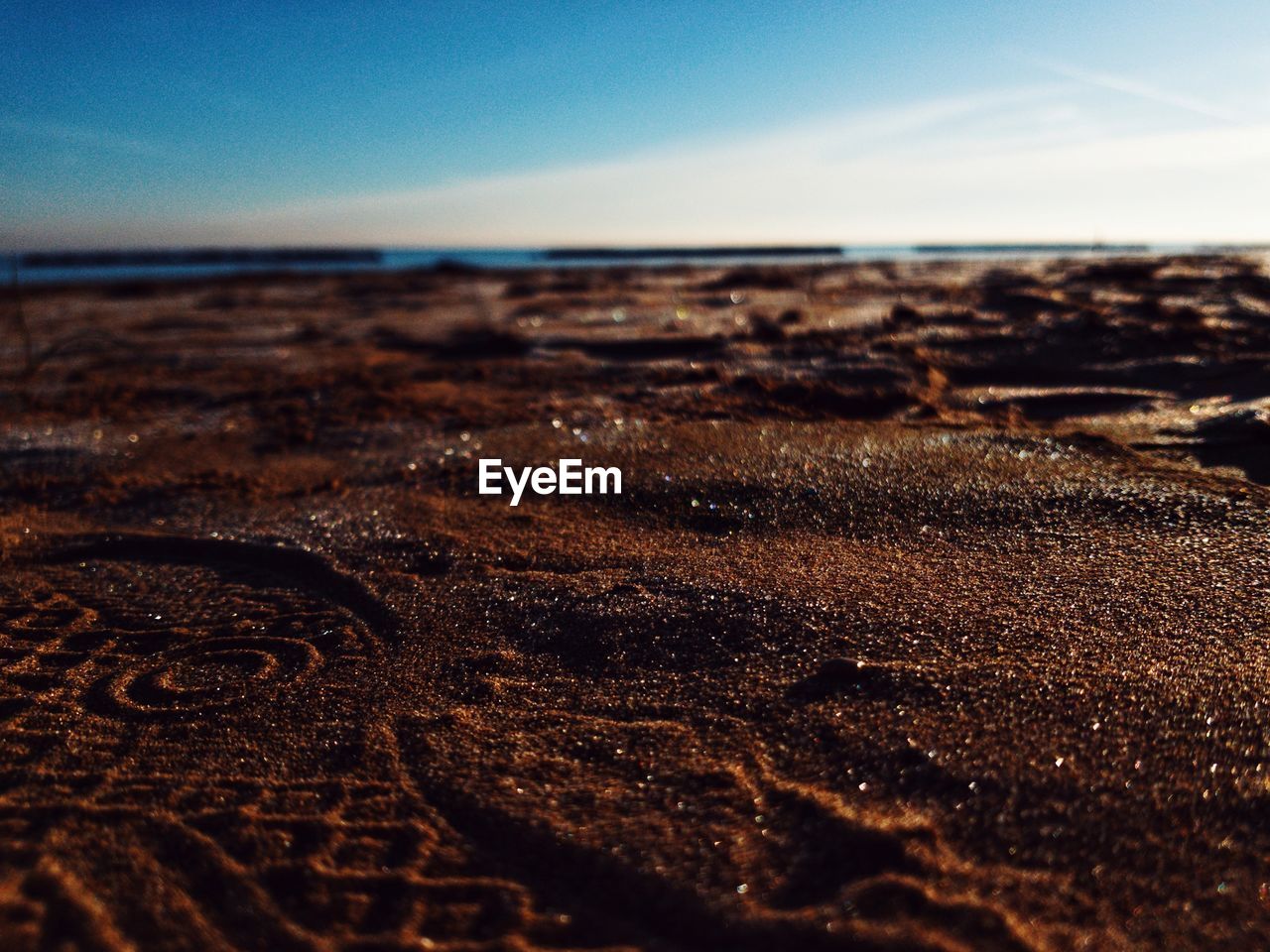 Surface level of beach against sky