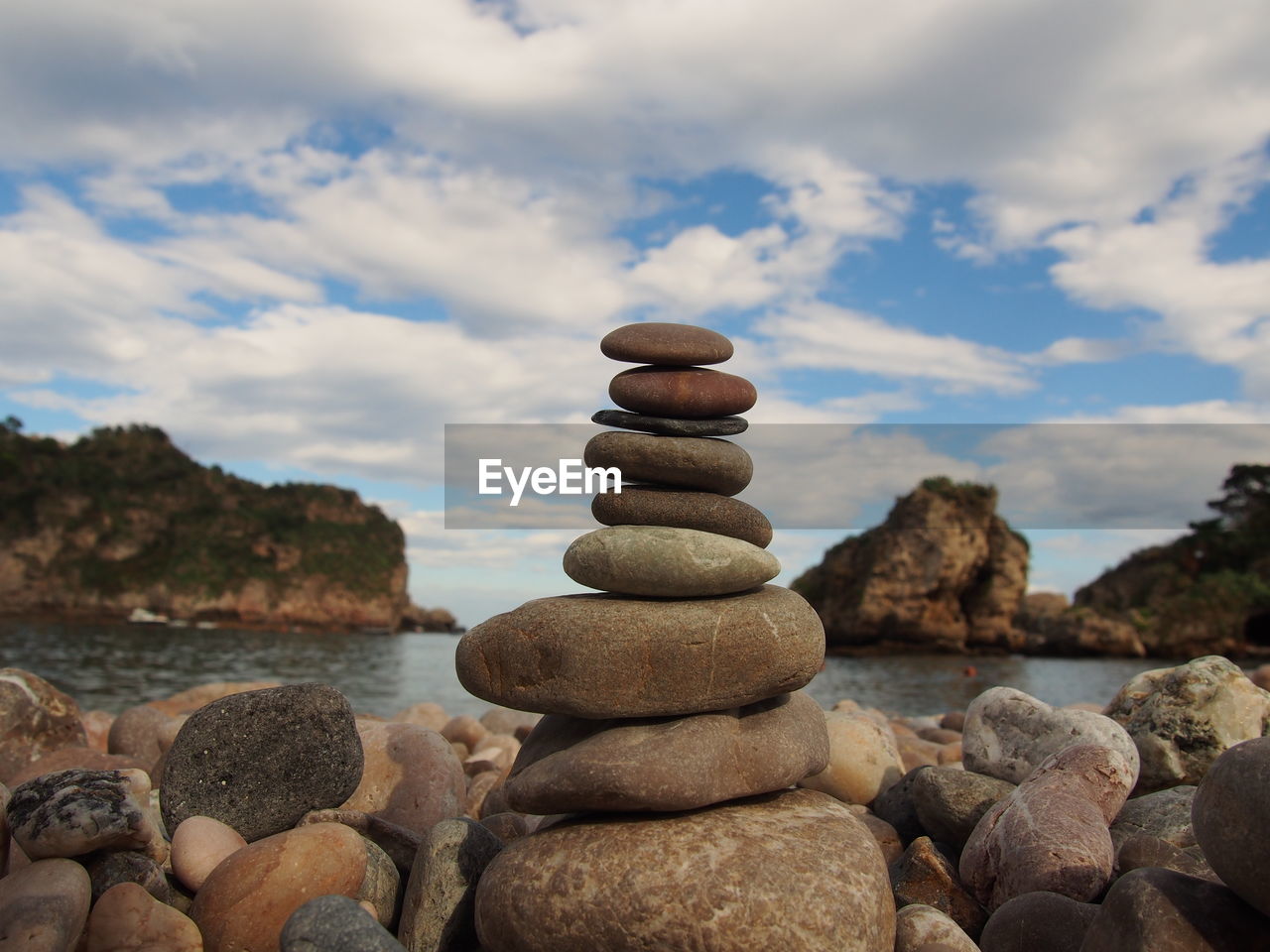 Close-up of stack of stones on the beach