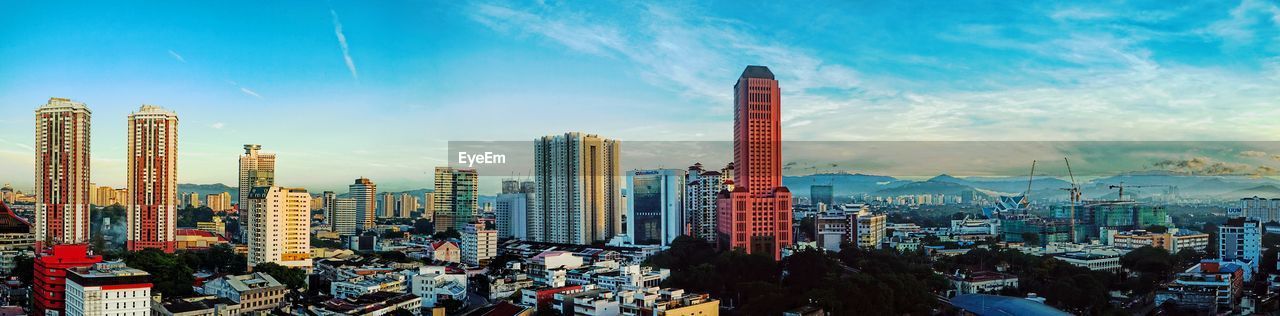 Panoramic view of cityscape against sky