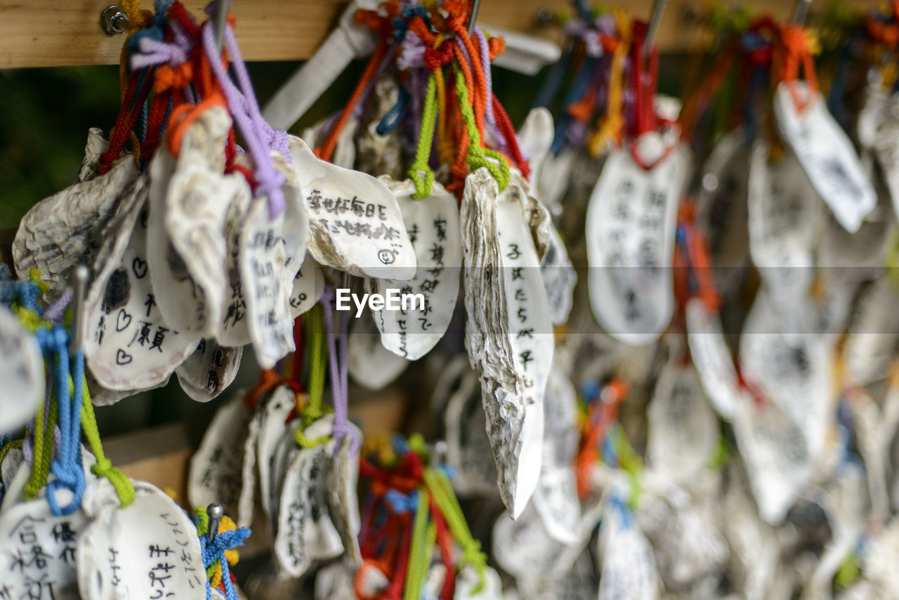 CLOSE-UP OF MULTI COLORED CLOTHES HANGING