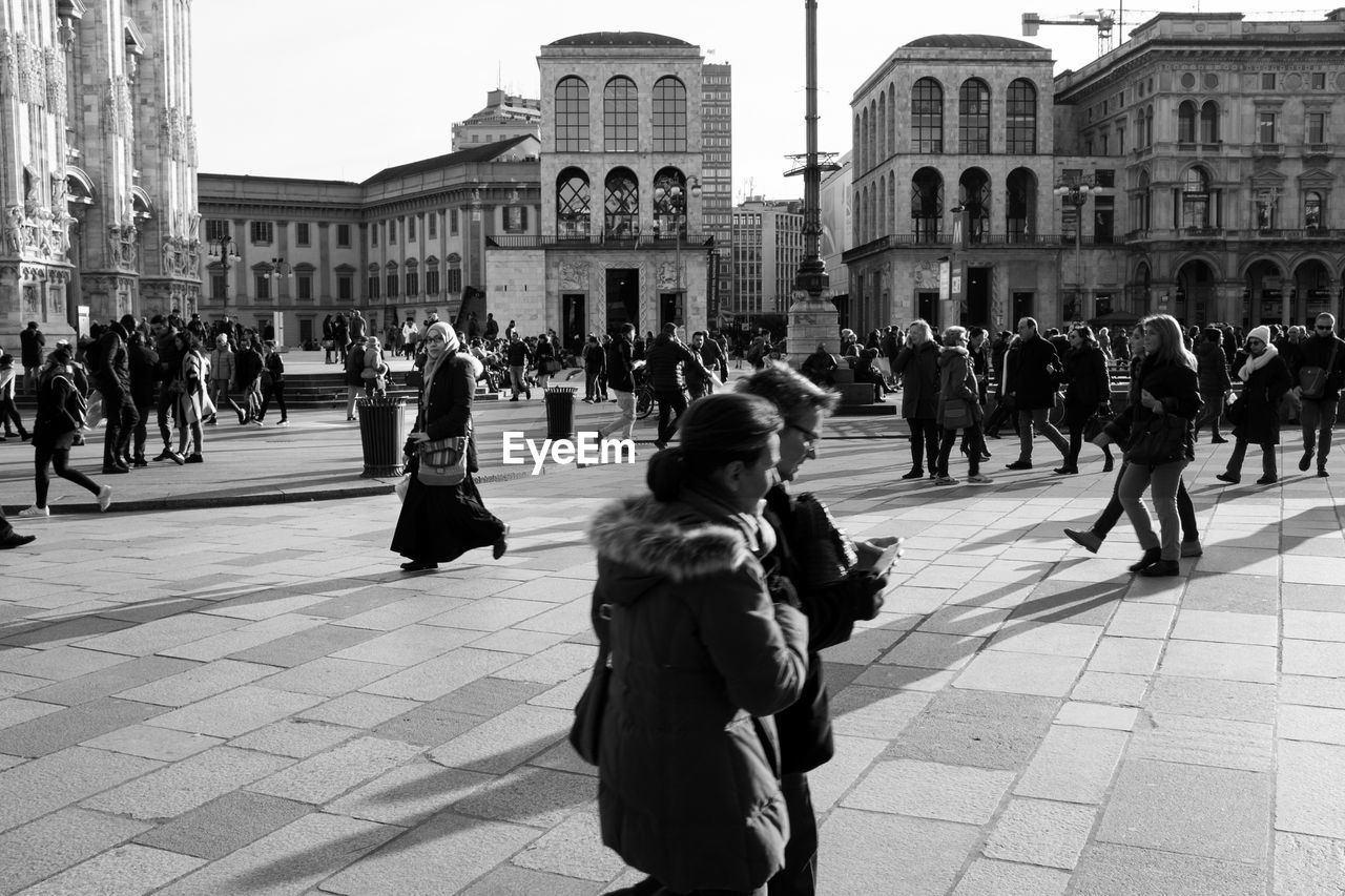 PEOPLE WALKING IN CITY