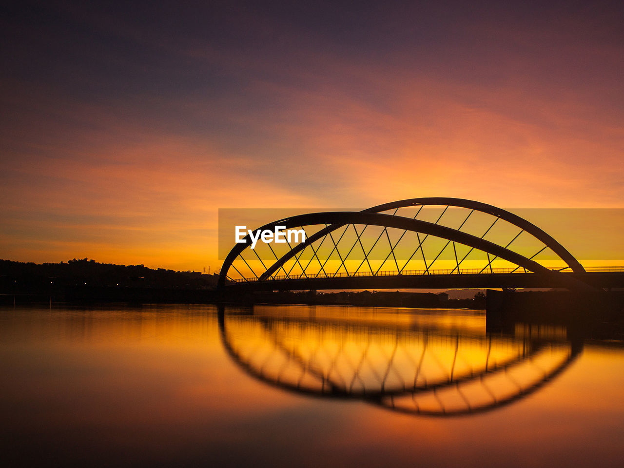 SILHOUETTE ARCH BRIDGE AGAINST SKY DURING SUNSET