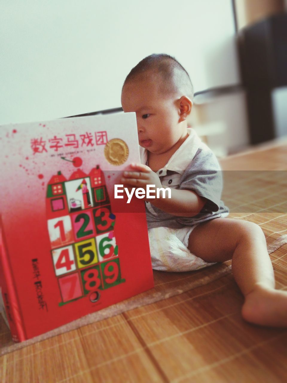 CUTE BOY PLAYING WITH BALL AT HOME