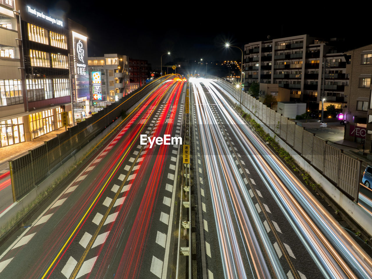 High angle view of light trails on road at night