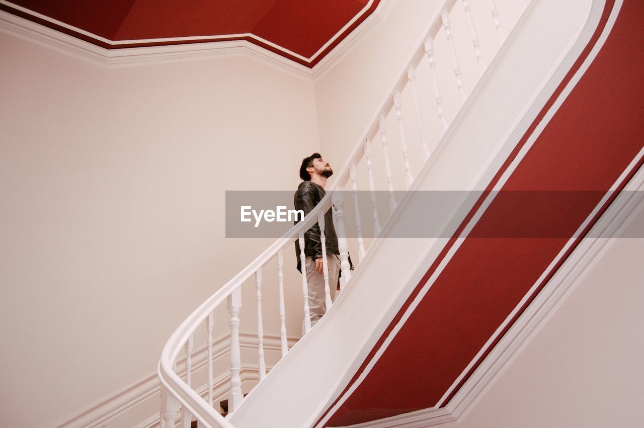 Low angle view of man on staircase