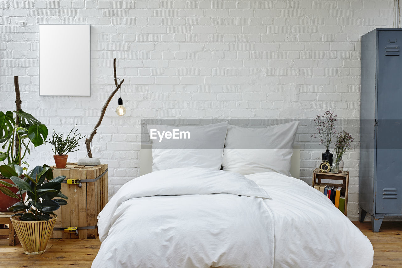 WHITE IMAGE OF BED WITH BEDROOM
