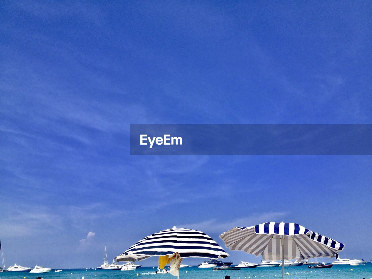 Built structure on beach against blue sky