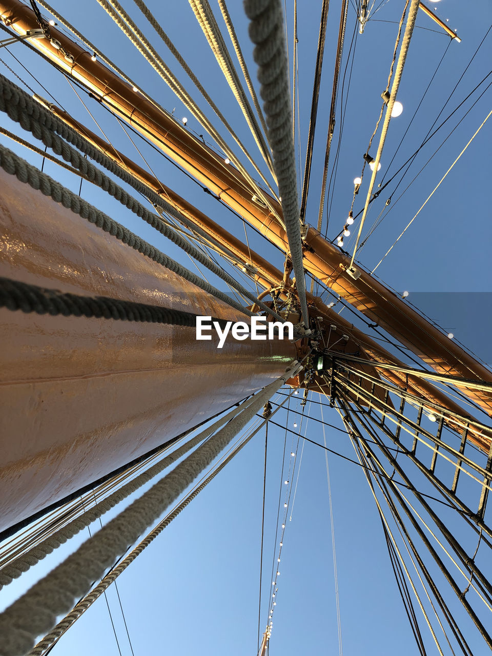 LOW ANGLE VIEW OF CABLES AGAINST SKY