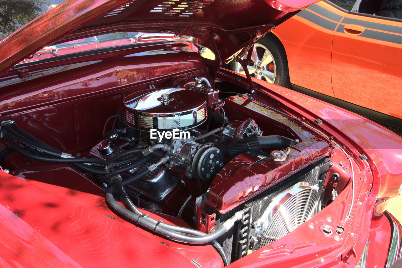 Chrome engine parts in a red sled