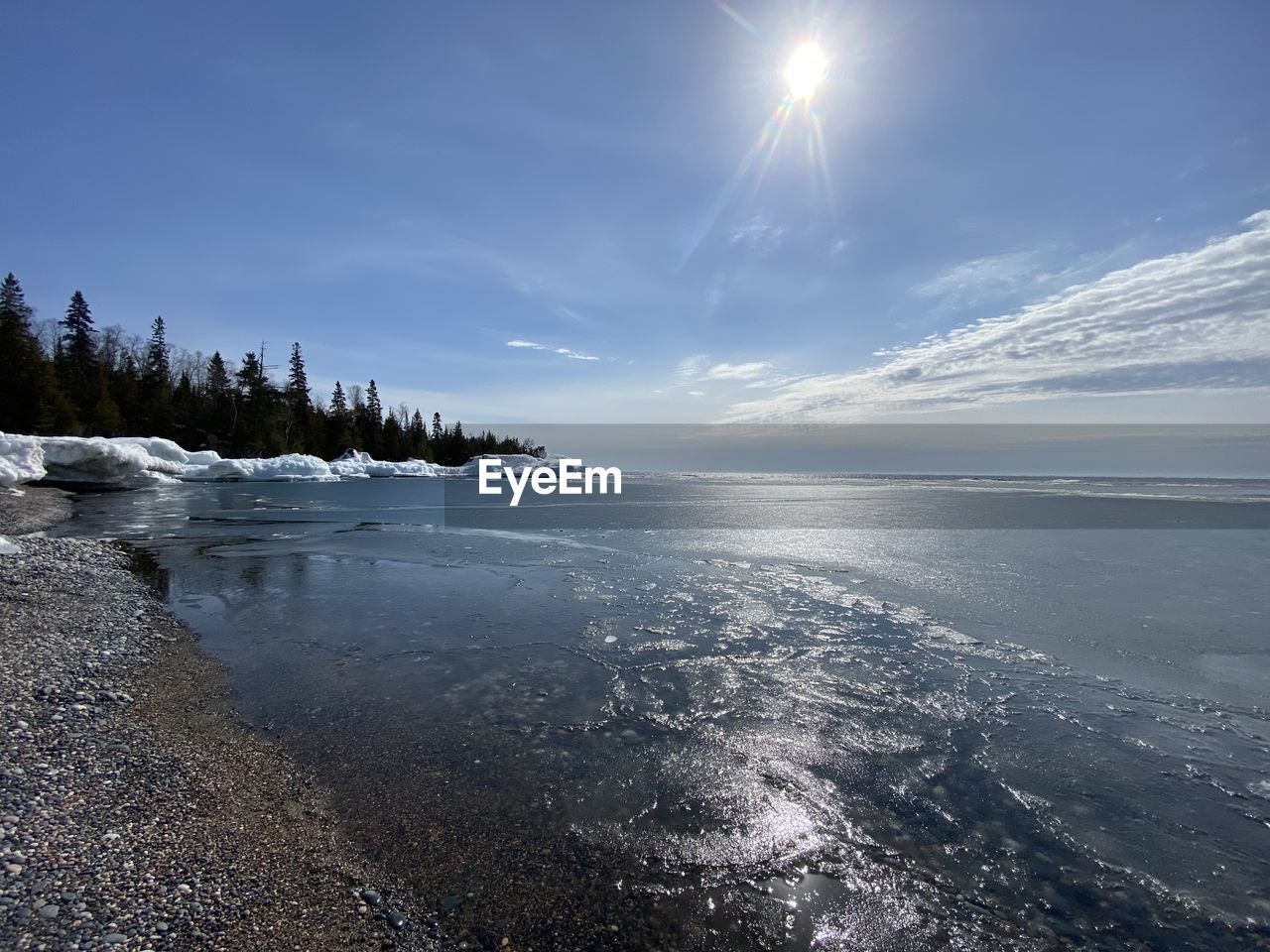 Scenic view of sea against sky during winter