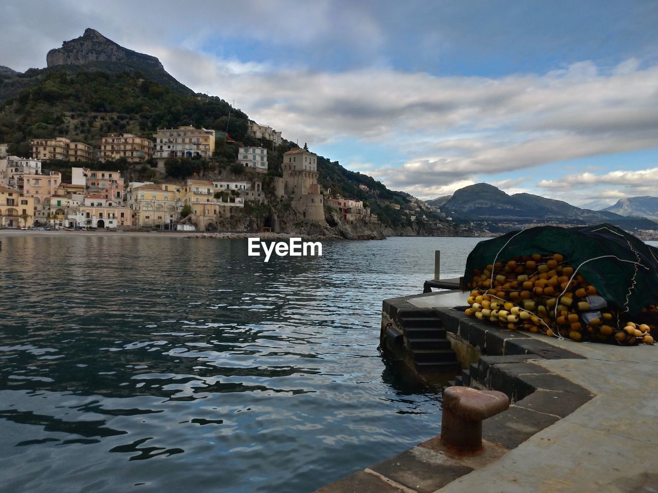 Scenic view of sea and buildings against sky