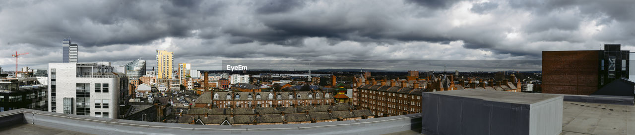 PANORAMIC VIEW OF BUILDINGS AGAINST SKY