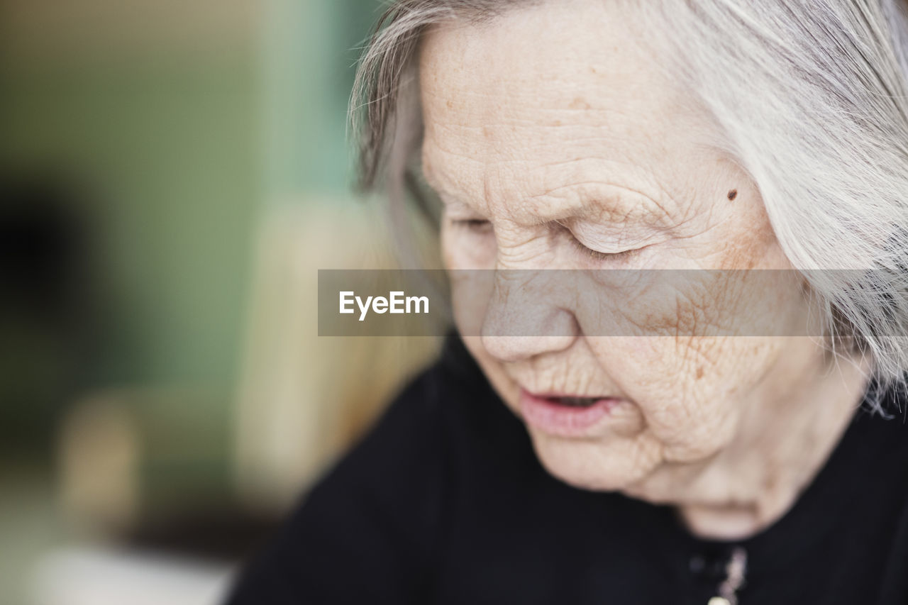 Close-up of thoughtful senior woman at nursing home