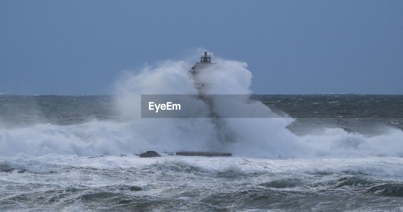 water, sea, motion, wind wave, ocean, wave, power in nature, coast, beauty in nature, splashing, nature, sky, no people, shore, breaking, blowhole, outdoors, day, scenics - nature, sports, hitting, wind, clear sky, water sports, environment