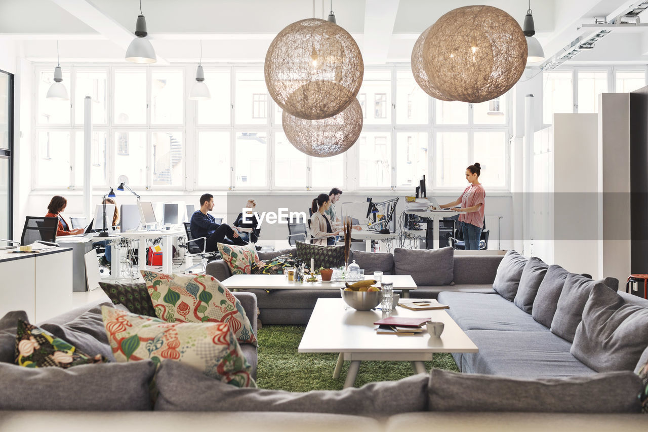 Modern office lobby with business people working in background