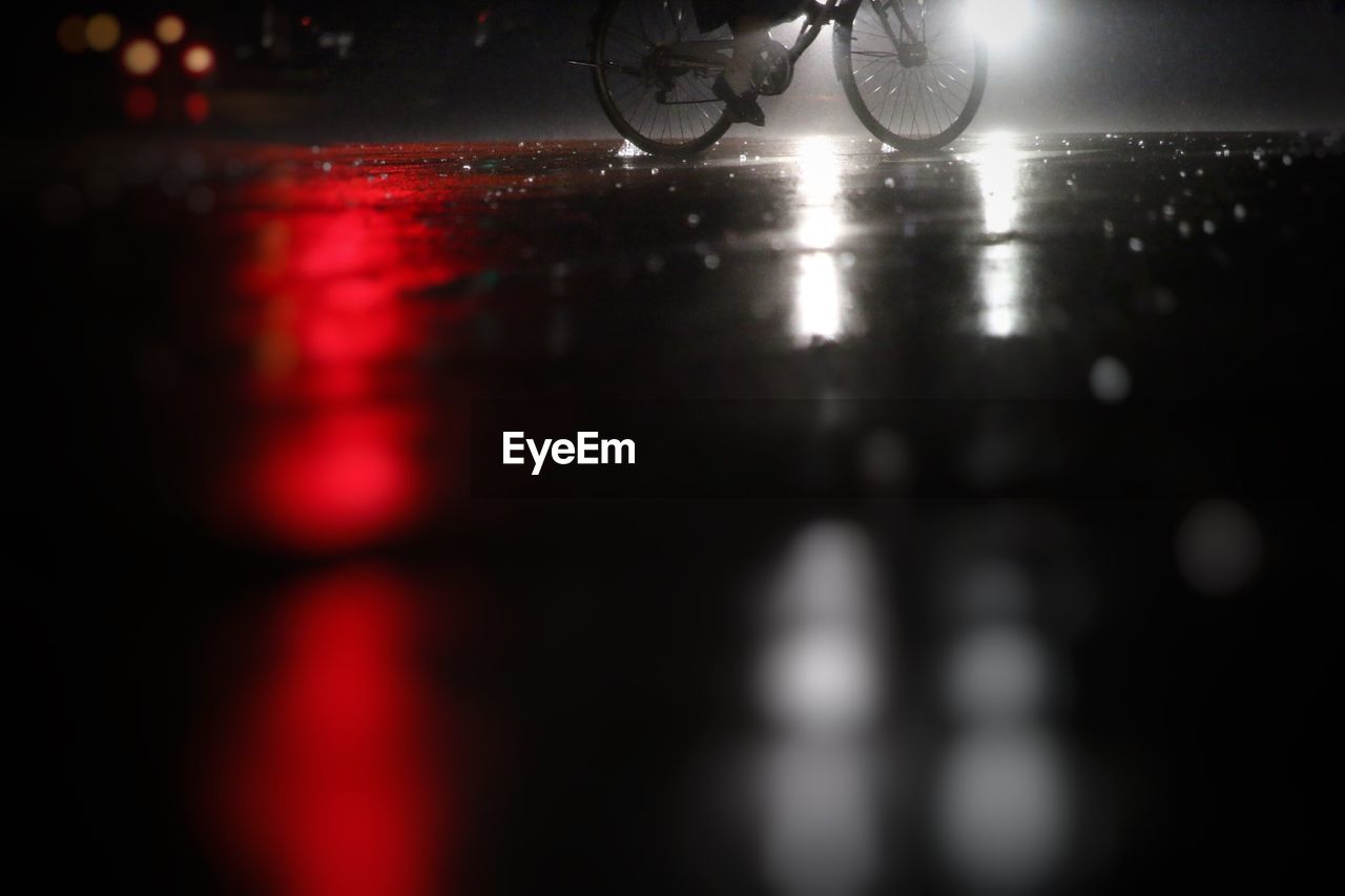 Bicycle on street at night during monsoon