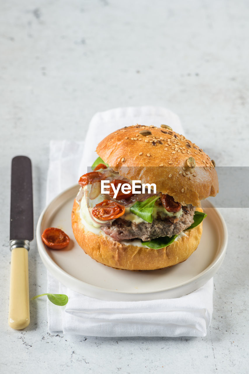 Close-up of burger in plate on table