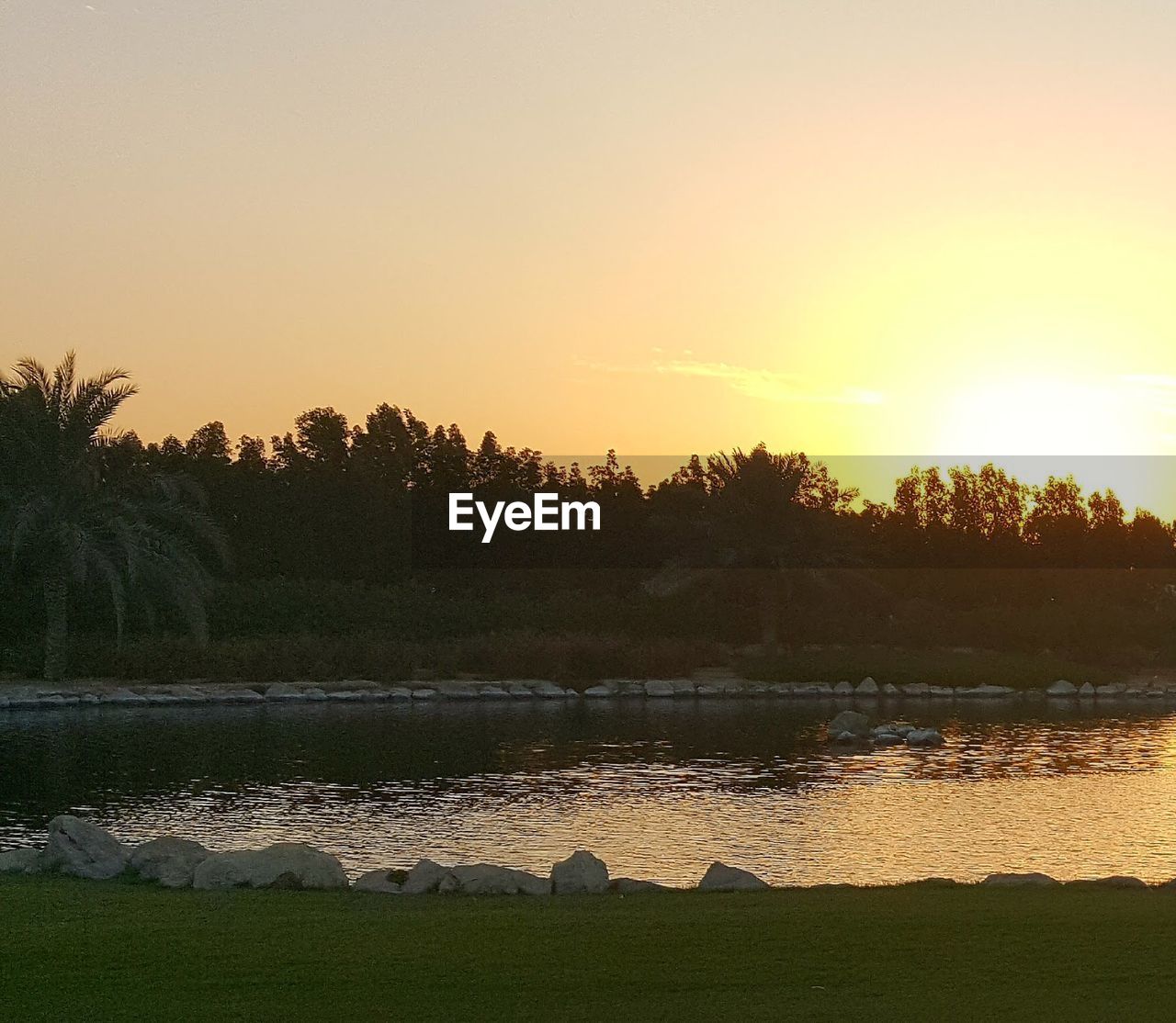 VIEW OF LAKE AT SUNSET