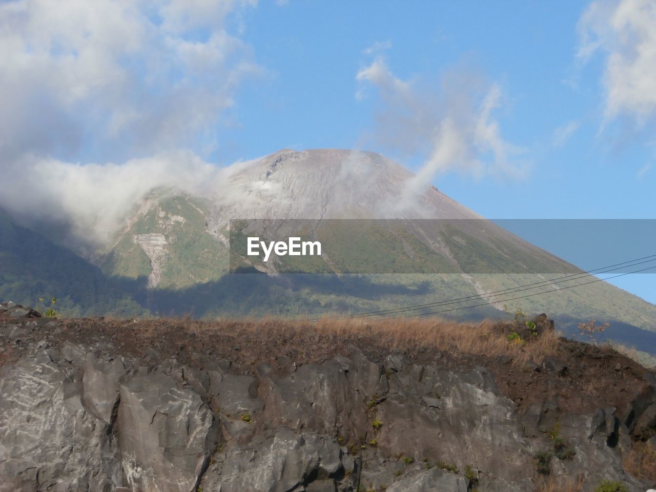 Panoramic view of volcanic landscape against sky