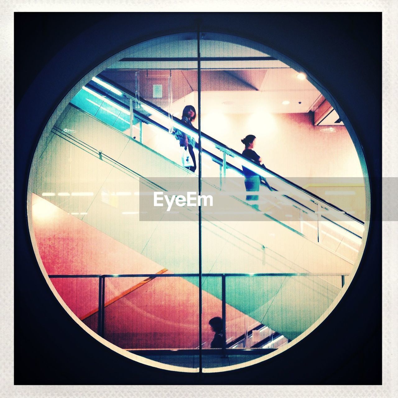 Escalator as seen through round window