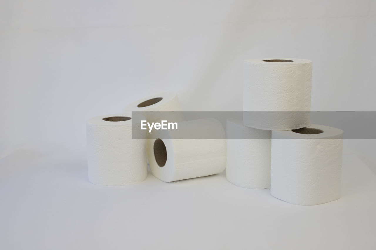 toilet paper, paper towel, paper, cylinder, rolled up, indoors, white, no people, ceramic, hygiene, studio shot, white background, bathroom