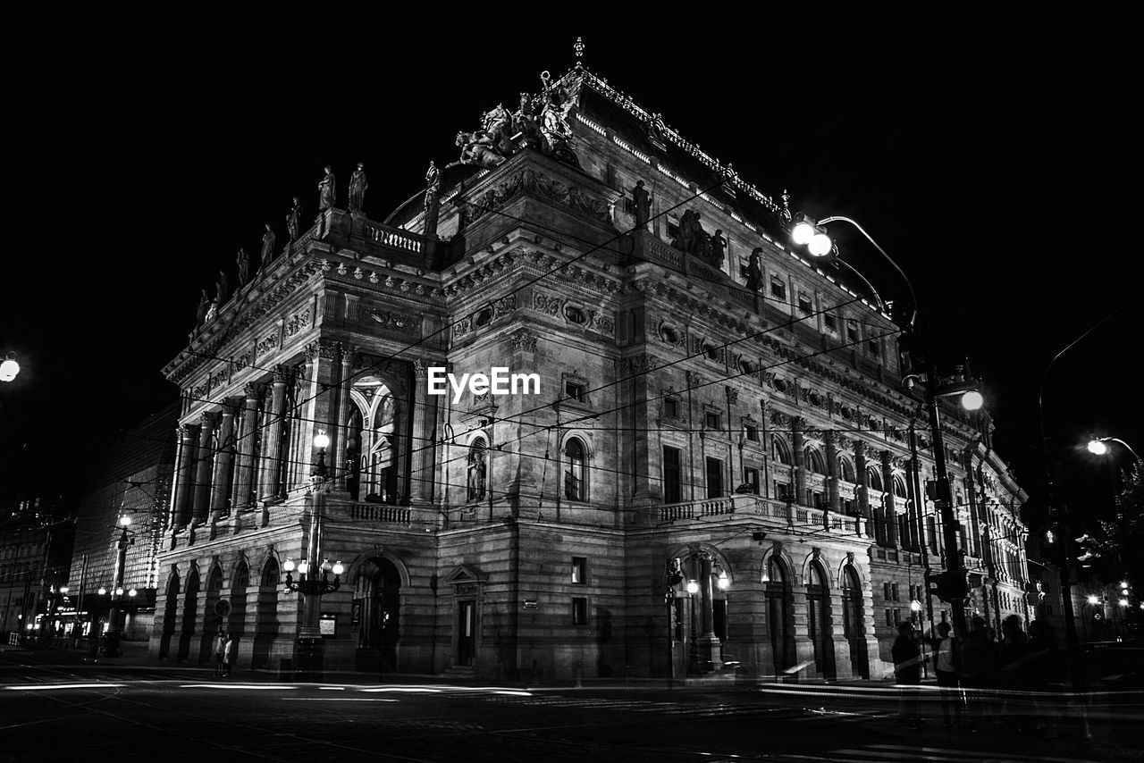 Low angle view of illuminated building at night