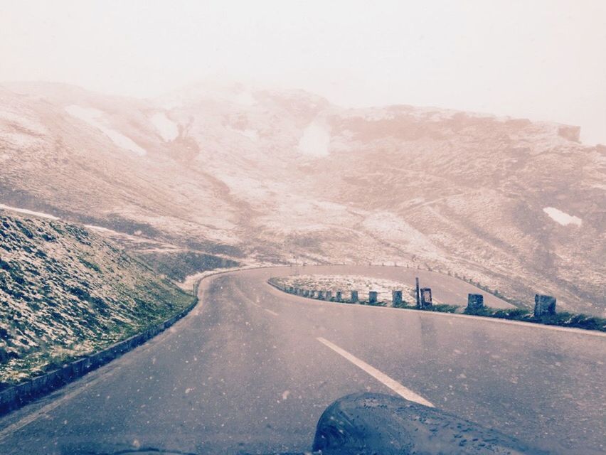 ROAD PASSING THROUGH MOUNTAINS