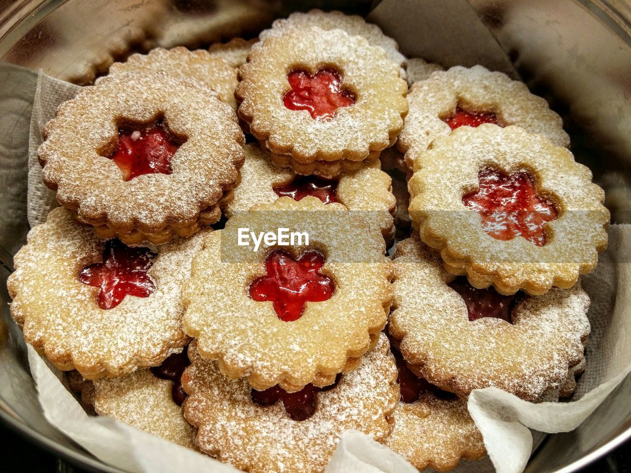 High angle view of jam cookies in container