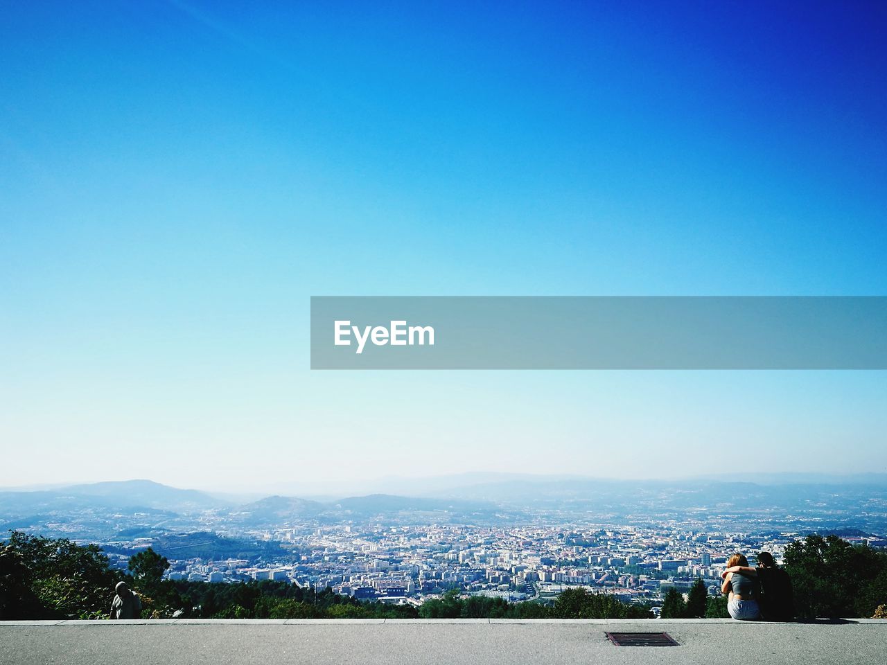 VIEW OF TOWNSCAPE AGAINST BLUE SKY