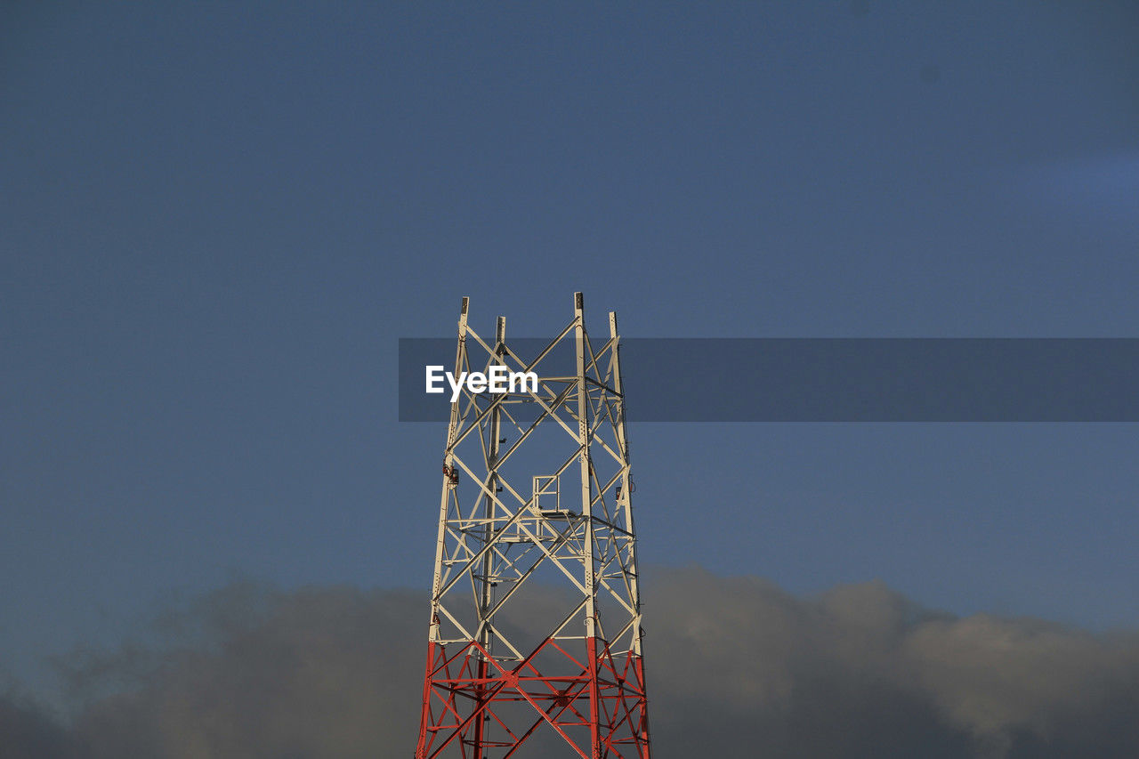 sky, technology, tower, built structure, transmission tower, architecture, communication, nature, global communications, communications tower, overhead power line, no people, cloud, broadcasting, low angle view, electricity, outdoors, metal, copy space, wireless technology, industry, satellite, satellite dish, blue, clear sky, power generation, mast, antenna, day