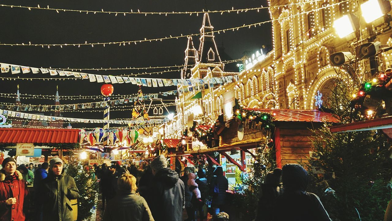 PANORAMIC VIEW OF CHRISTMAS LIGHTS AT NIGHT