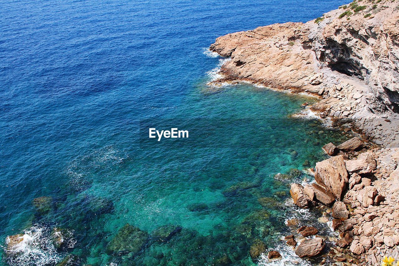 High angle view of rocks on beach