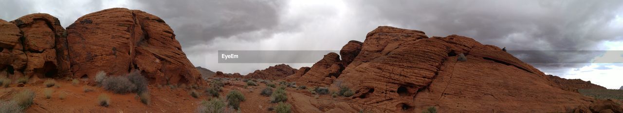 Rocky landscape against clouds