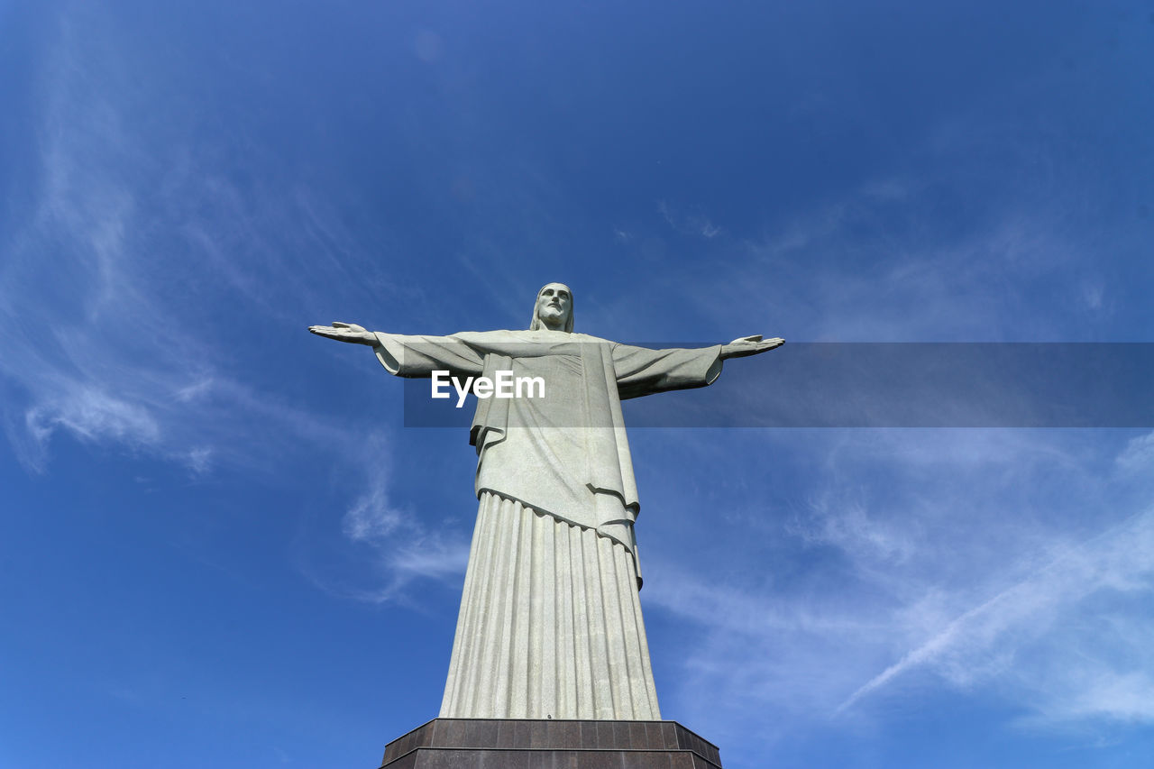 Low angle view of christbthe redeemer against blue sky