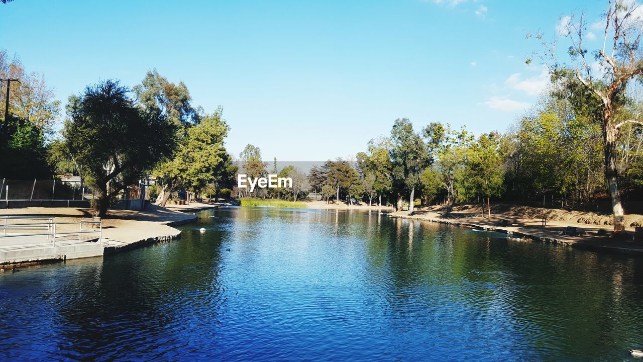 Scenic view of calm lake against clear sky