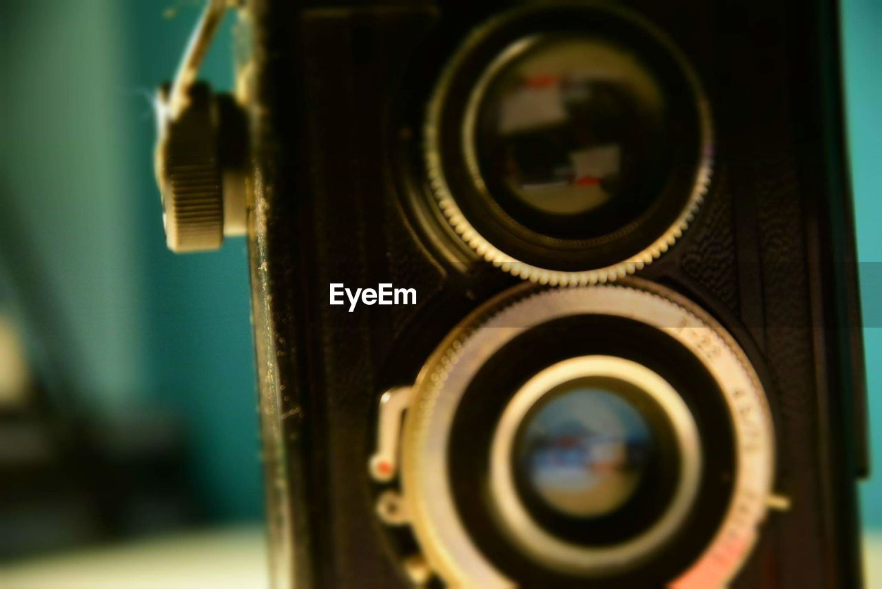 Close-up of vintage camera at home