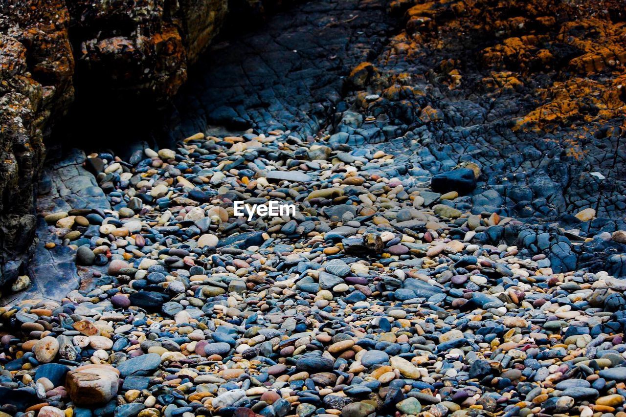 High angle view of pebbles on field