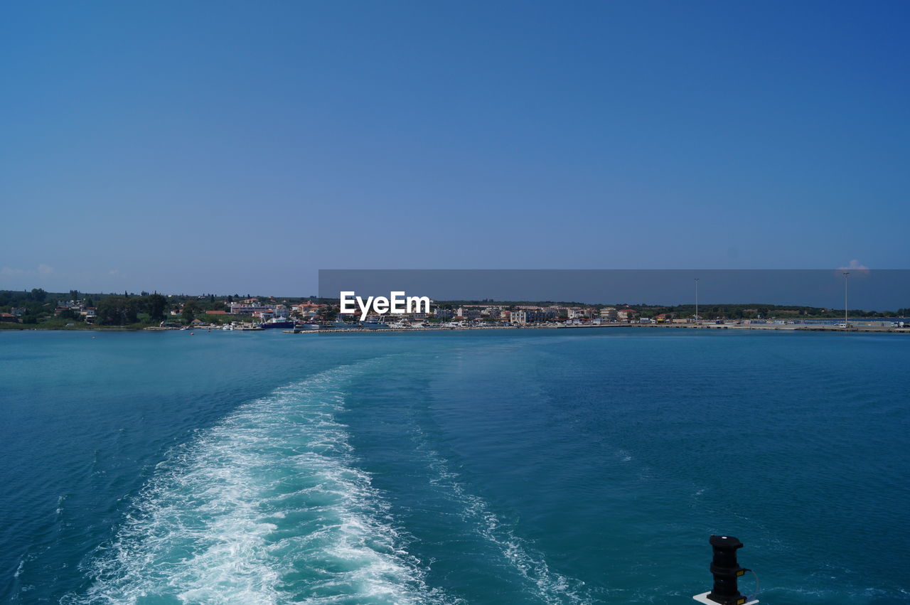 Scenic view of sea against clear blue sky