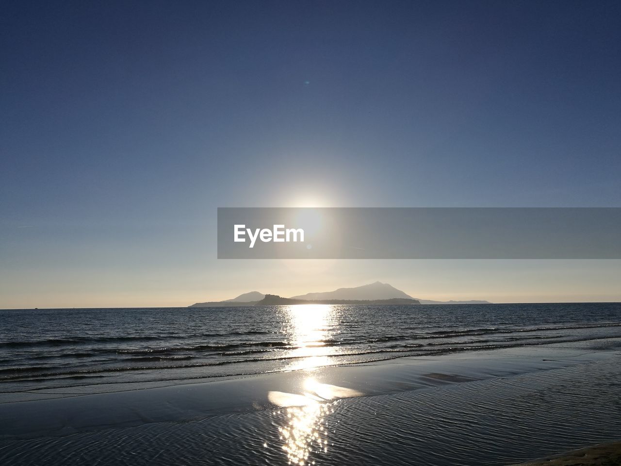 Scenic view of sea against sky at sunset