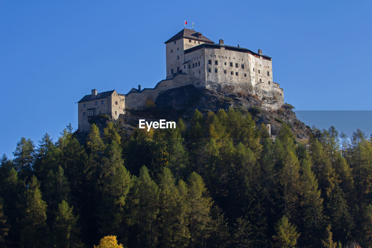 Low angle view of historical building against blue sky