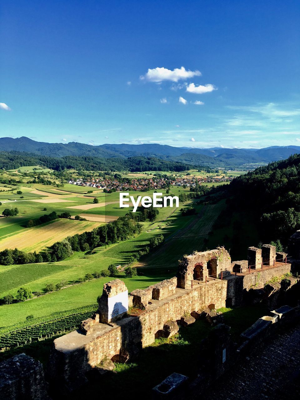 Scenic view of landscape against blue sky