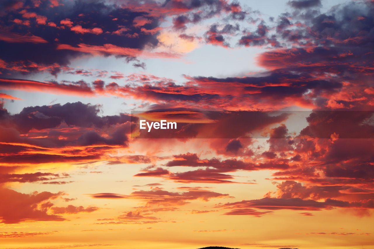 Low angle view of clouds in sky during sunset