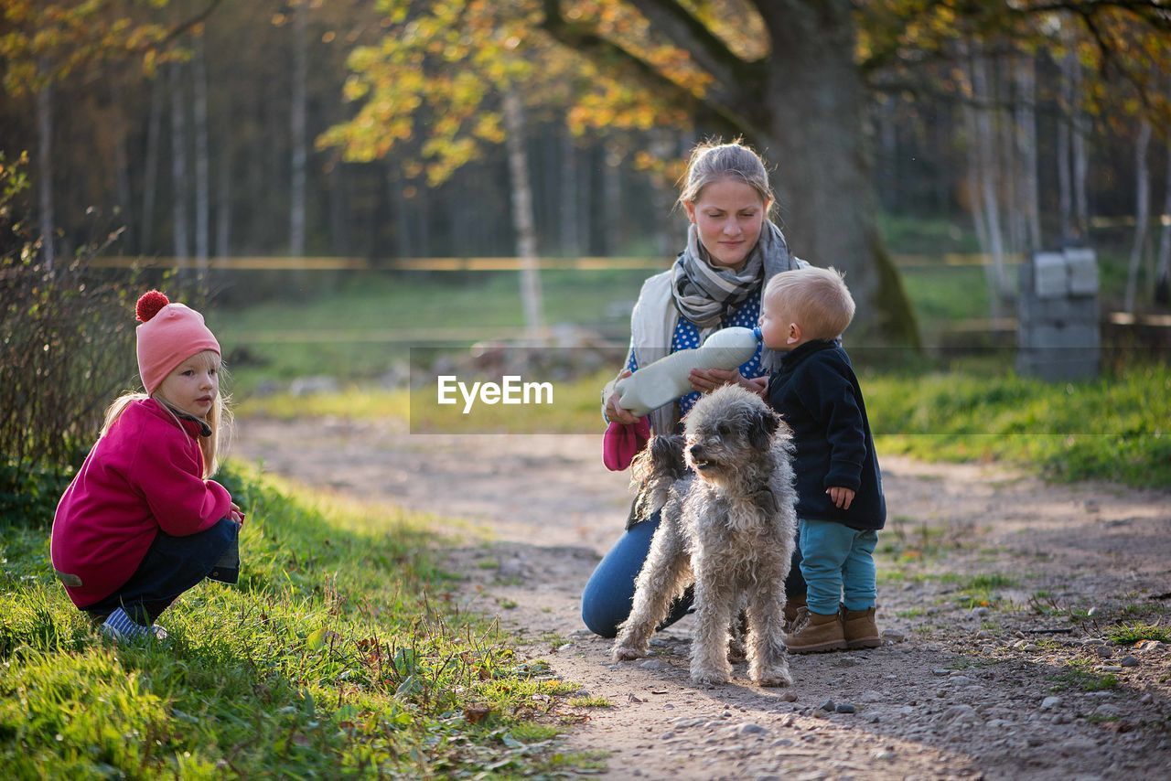 Family with dog at park