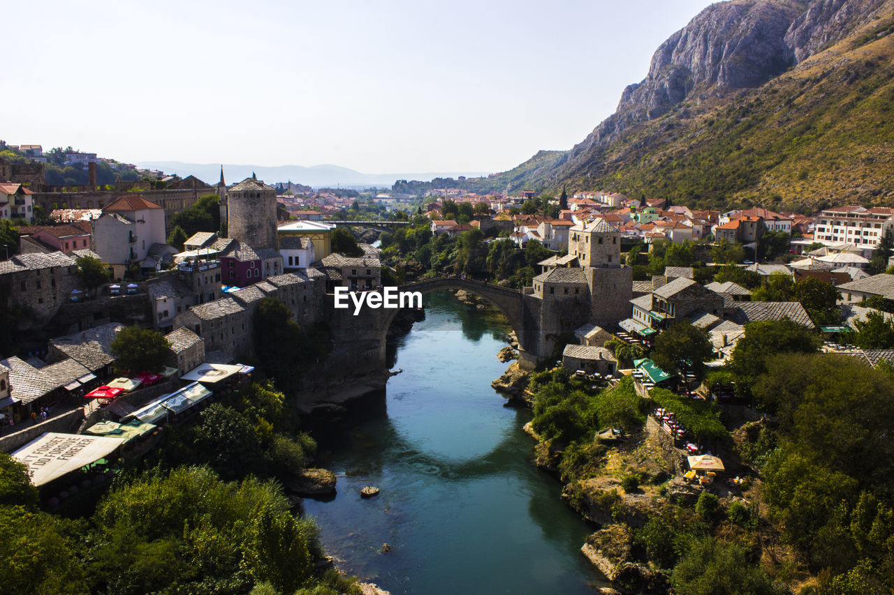 High angle view of river amidst buildings in town