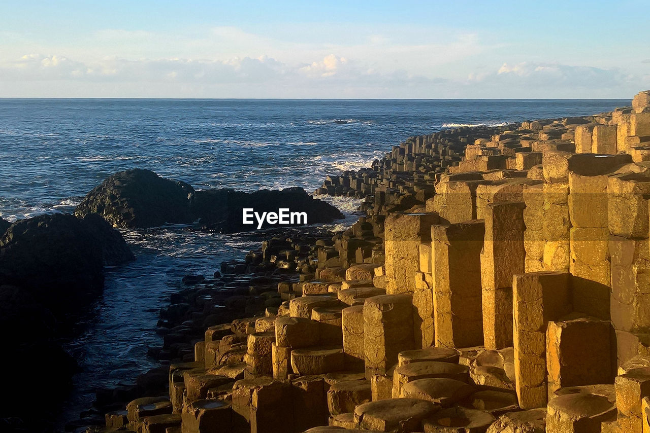 PANORAMIC VIEW OF SEA AND BUILDINGS AGAINST SKY